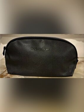 Skinstore pebbled vegan leather travel toiletry bag. Approx 12x6x3 inches